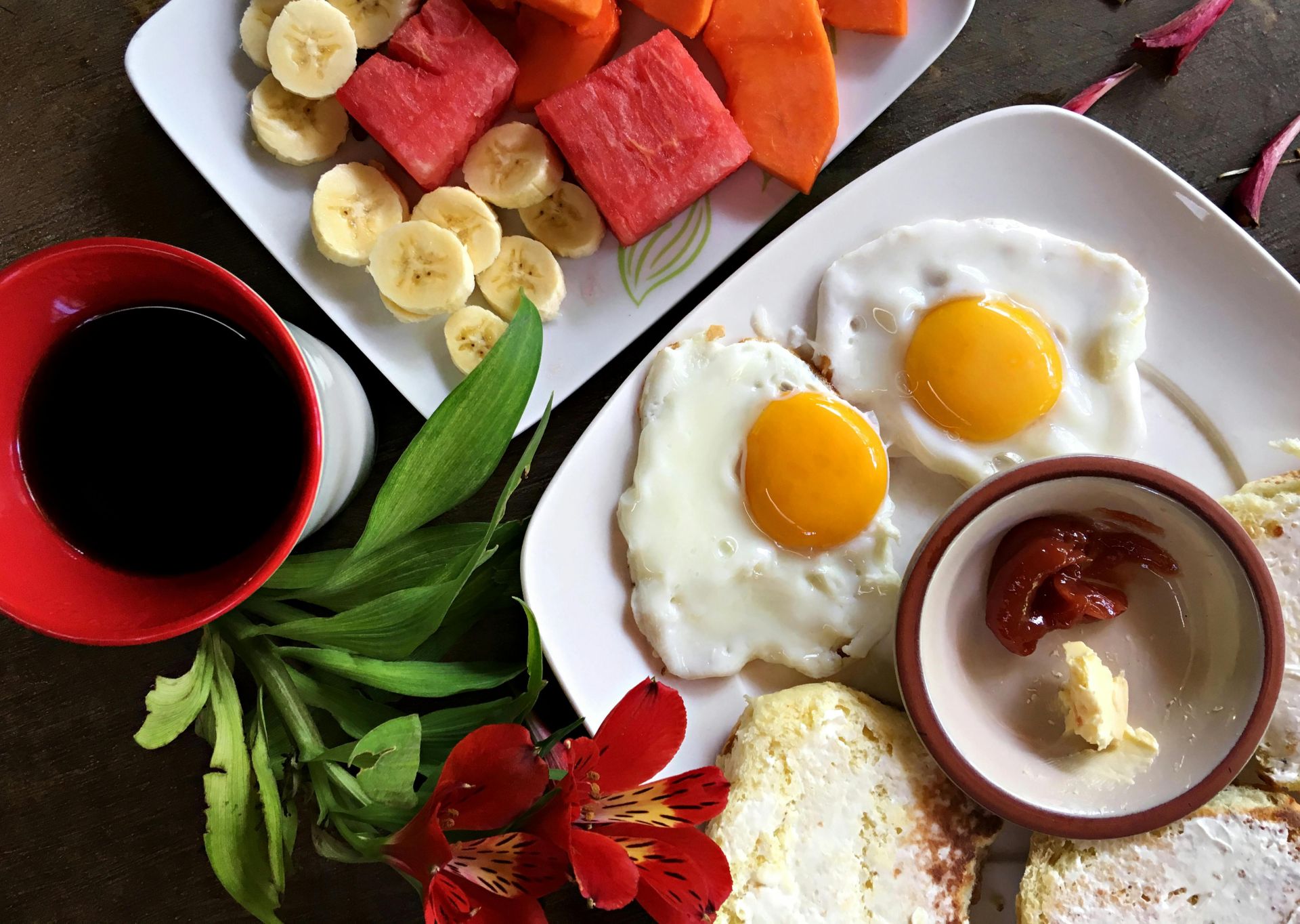 Healthy breakfast featuring eggs, fruits, and coffee arranged beautifully for a vibrant start.